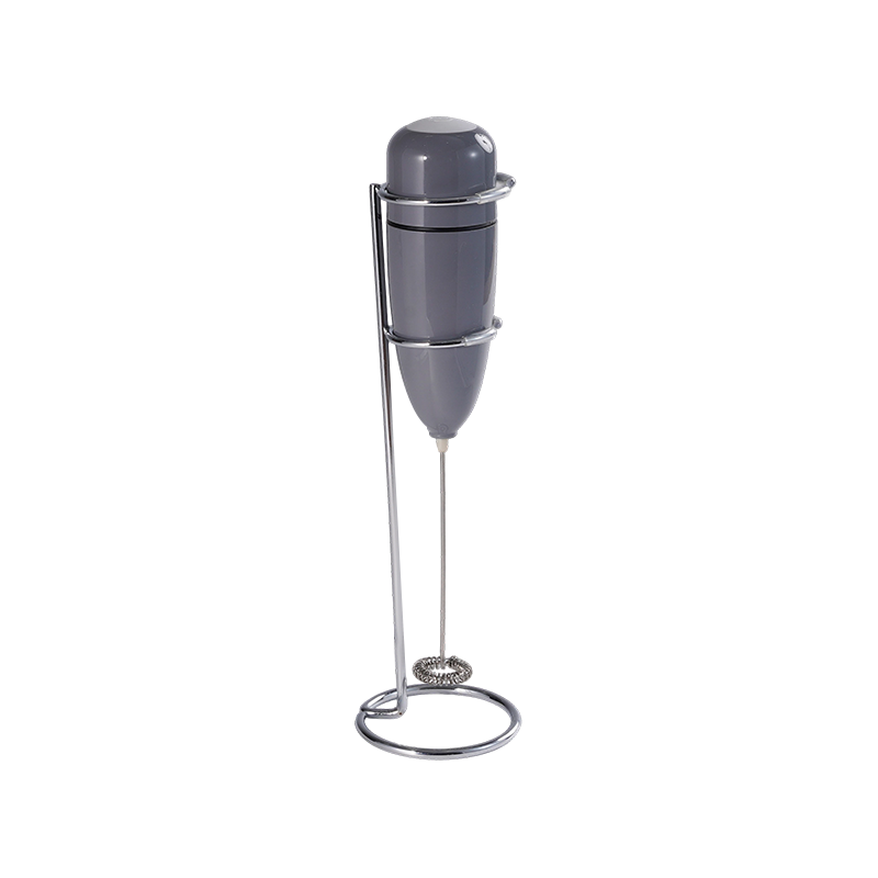 Handheld battery-powered milk frother with bottle